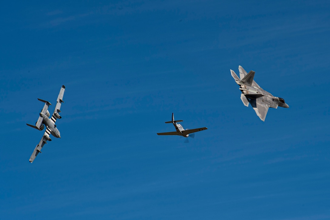 An F-22 Raptor assigned to the F-22 Demonstration Team performs a heritage formation flight with a P-51 Mustang and A-10C Thunderbolt II during the 2019 Thunder Over South Georgia open house Nov. 3, 2019, at Moody Air Force Base, Ga.
