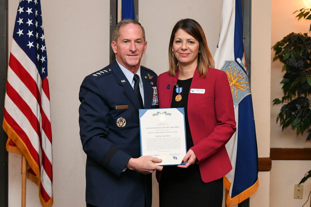 U.S. Air Force Chief of Staff Gen. David L. Goldfein presents the Distinguished Public Service Award to Ms. Wendy Gramza during the Air Force Civic Leader Conference at Joint Base Andrews, Md., Jan. 30, 2020. At the conference, five civic leaders were presented the Distinguished Public Service Award. (U.S. Air Force Photo by Airman 1st Class Spencer Slocum)