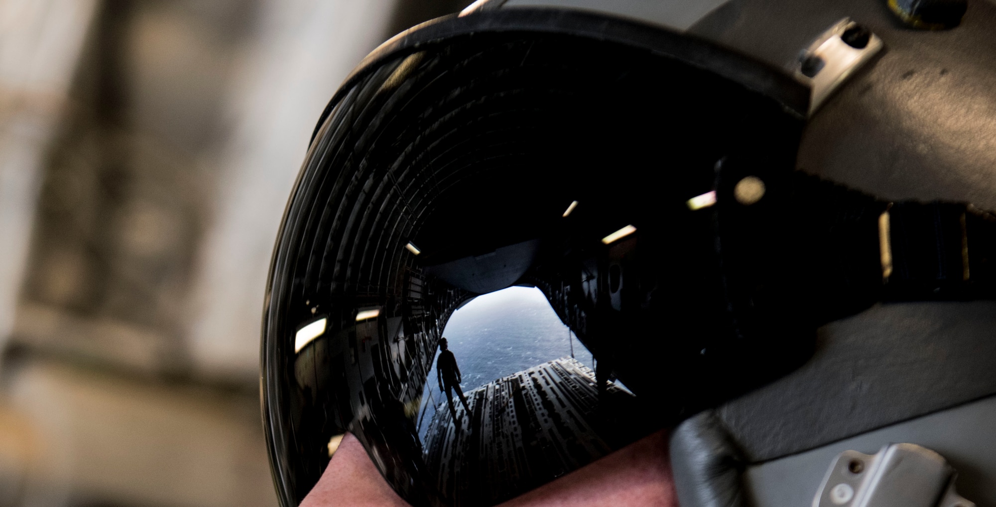 Senior Airman Christopher Warman, 14th Airlift Squadron loadmaster, watches the ramp of a C-17 Globemaster III during Air Mobility Command Test and Evaluation Squadron’s assessment of tactics, techniques and procedures for astronaut rescue and recovery efforts Jan. 22, 2020, off the coast of Florida near Patrick Air Force Base.