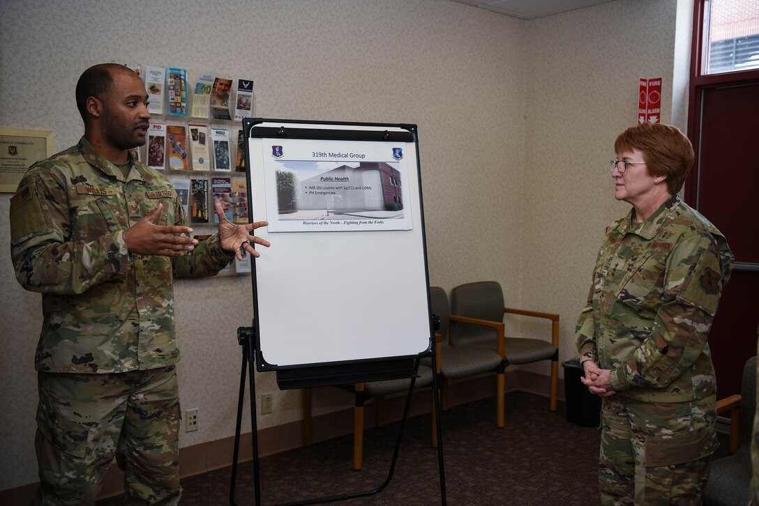 Senior Airman D’andre Willis, left, a public health technician assigned to the 319th Operational Medical Readiness Squadron, briefs Lt. Gen. Dorothy A. Hogg, Air Force Surgeon General, during her tour of the 319th Medical Group at Grand Forks Air Force Base, N.D., Jan. 27, 2020. Willis discussed the current status of public health as well as the accomplishments throughout the facility over the last year. (U.S. Air Force photo by Senior Airman Melody Howley)