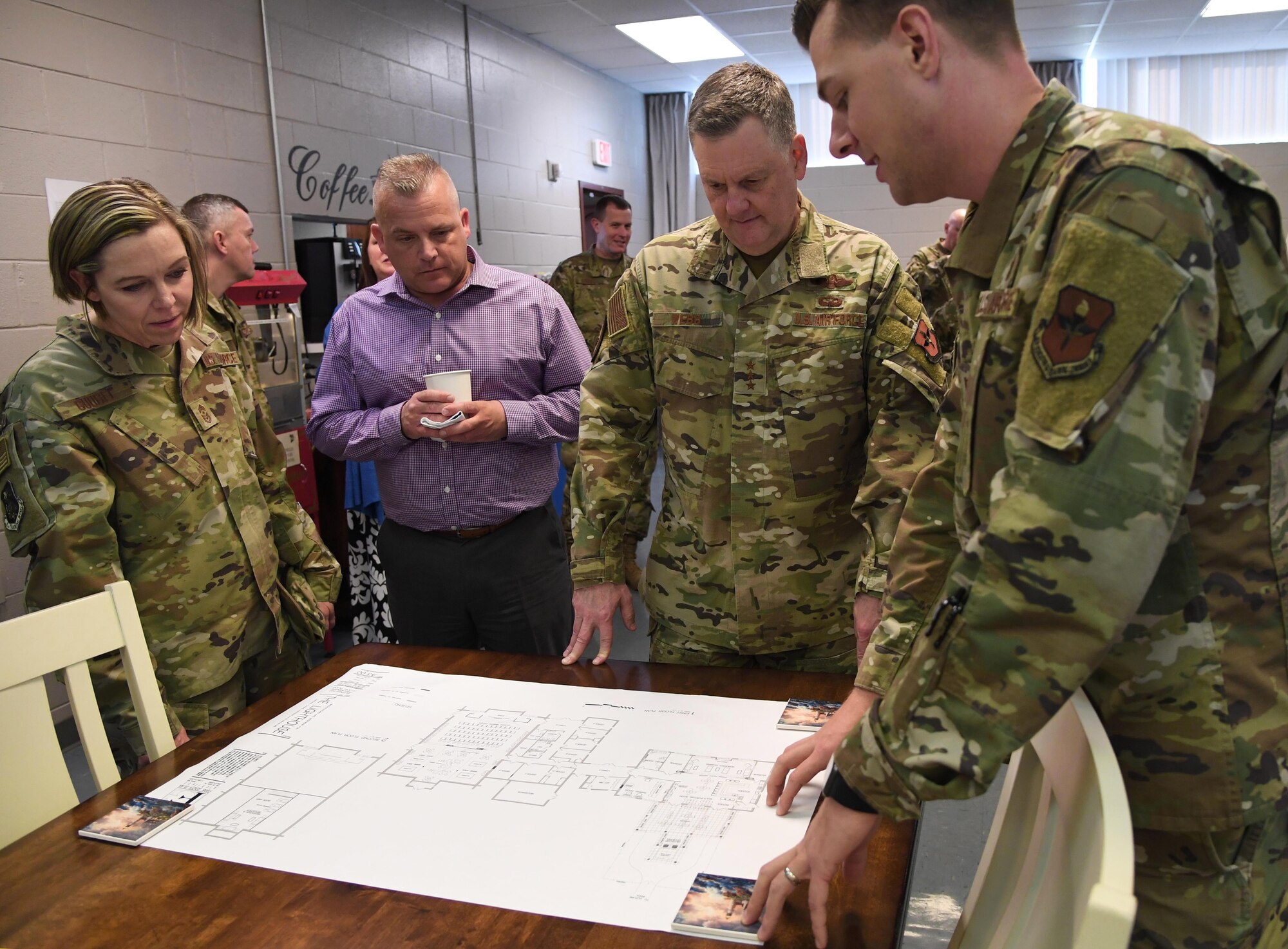 U.S. Air Force Capt. Steven Wichern, 81st Training Wing chaplain, reviews a drawing of The Lighthouse improvements to Lt. Gen. Brad Webb, commander of Air Education and Training Command, and Chief Master Sgt. Julie Gudgel, command chief of AETC, and her husband, Robb Gudgel, during an immersion tour inside the Larcher Chapel at Keesler Air Force Base, Mississippi, Jan. 31, 2020. The AETC command team visited Keesler in order to become more familiar with the mission capabilities of the 81st Training Wing and to view the paradigm shift occurring in the training environment within the 81st Training Group. (U.S. Air Force photo by Kemberly Groue)