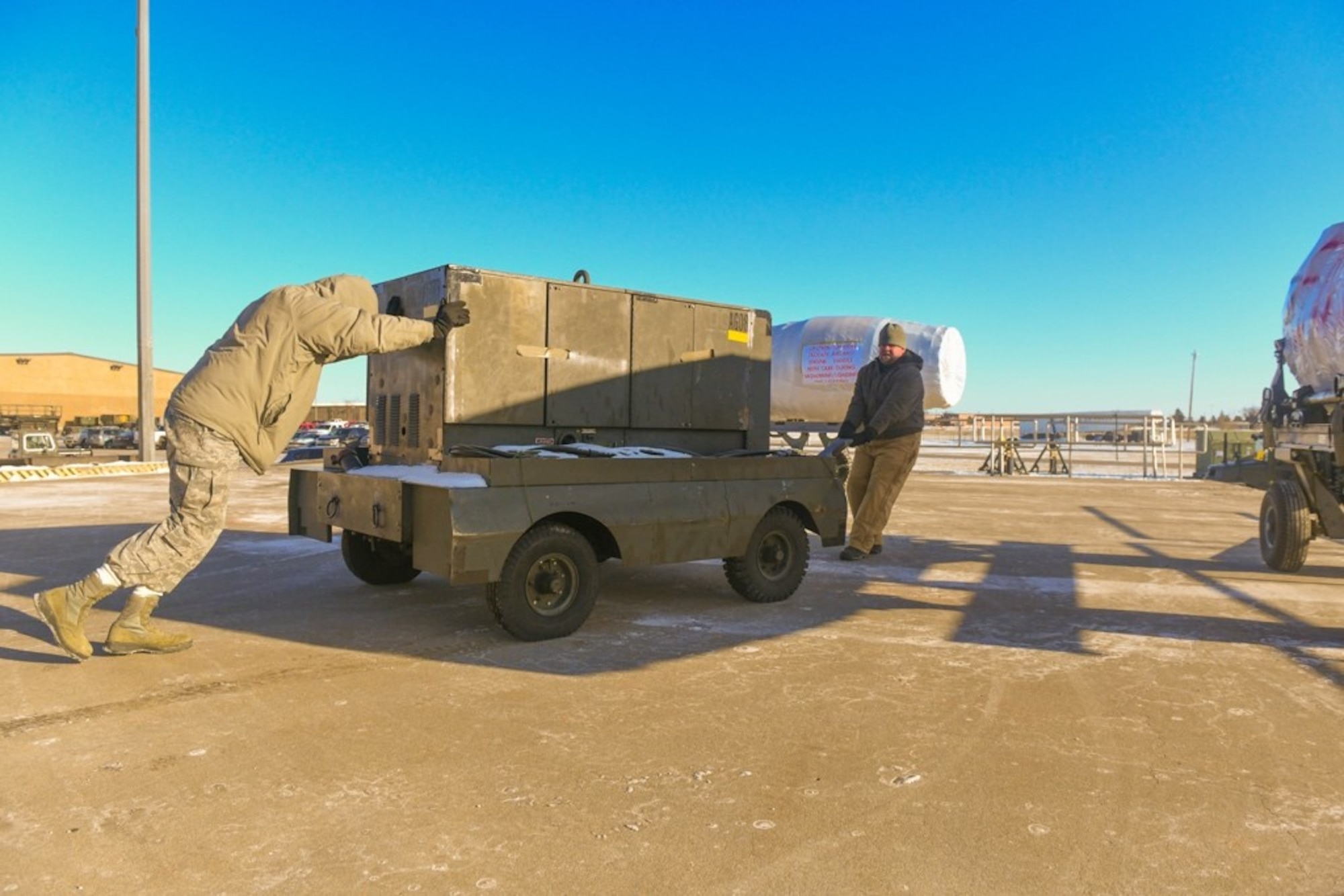Members of the 28th Logistics Readiness Squadron prepare to load a crate onto a semi-truck carrying supplies Jan. 16, 2020, at Ellsworth Air Force Base, S.D. Red Flag is an annual training exercise for both U.S. and coalition forces that provides realistic training through a simulated combat environment, preparing them for future exercises, missions and deployments. (U.S. Air Force photo by Senior Airman Michael Jones)