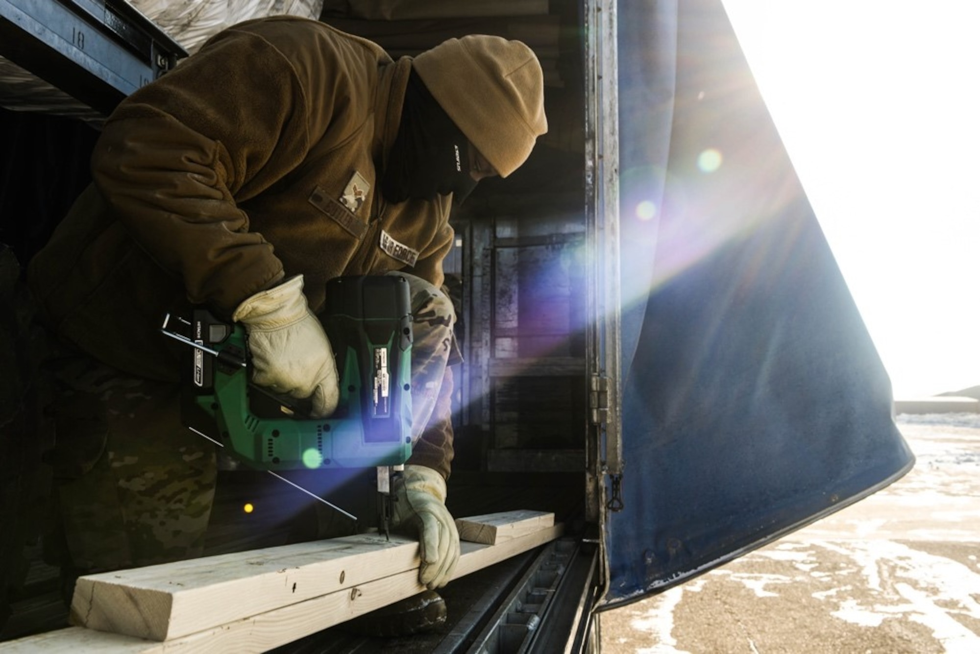 Airman 1st Class Michael Butler, 28th Logistics Readiness Squadron outbound cargo journeyman, secures a barrier at Ellsworth Air Force Base, S.D., Jan. 16, 2020. Red Flag is an annual training exercise for both U.S. and coalition forces that provides realistic training through a simulated combat environment, preparing them for future exercises, missions and deployments. (U.S. Air Force photo by Senior Airman Michael Jones)