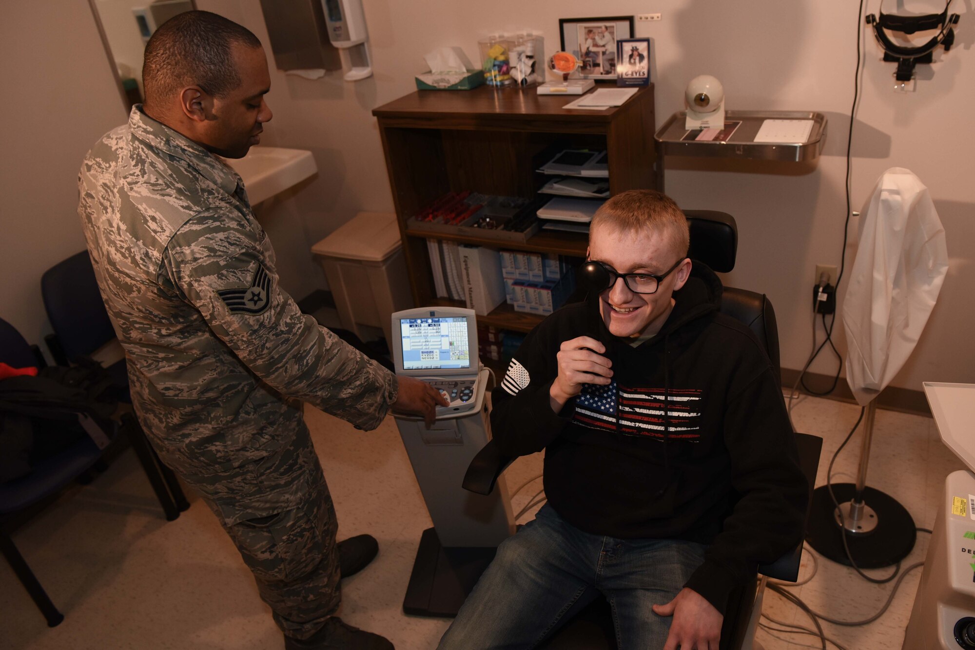 Staff Sgt. Aaron Prevost, 22nd Operational Medical Readiness Squadron NCO-in-charge optometry, performs a routine eye exam on Senior Airman Mitchel Delfosse, 22nd Aircraft Maintenance Squadron electrical environmental system journeyman, Jan. 30, 2020, at McConnell Air Force Base, Kansas. Delfosse visited the 22nd Medical Group to see optometry for a regular checkup. (U.S. Air Force photo by Airman 1st Class Alexi Bosarge)