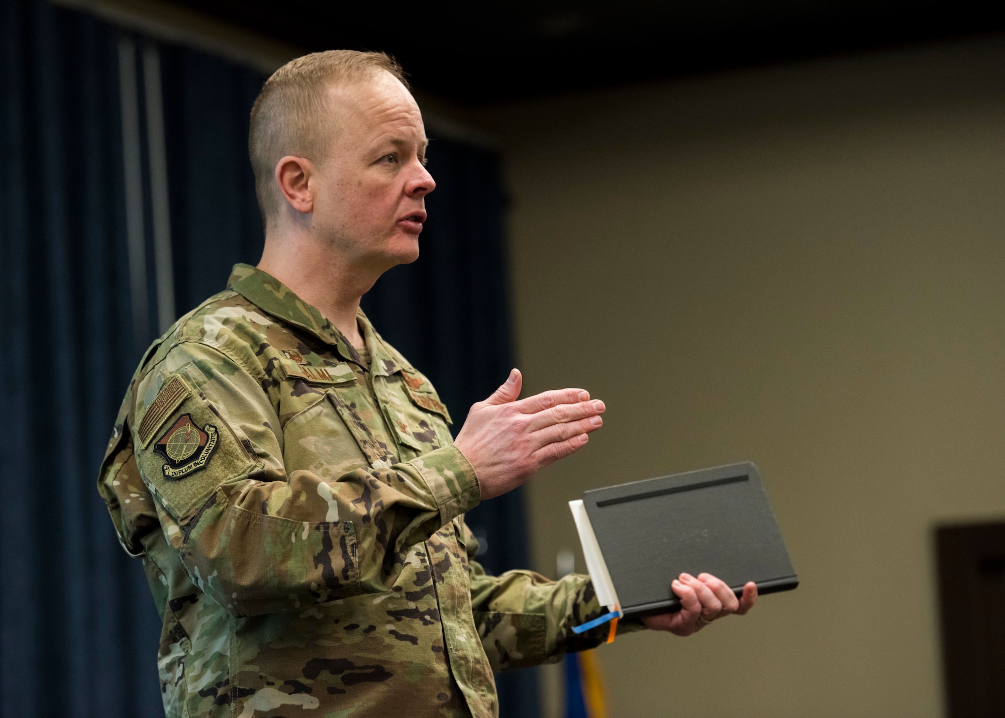 U.S. Air Force Col. Derek Salmi, 92nd Air Refueling Wing commander, addresses attendees of an officer's all-call at Fairchild Air Force Base, Washington, Jan. 28, 2020. The first change addressed was the restructuring of developmental categories, effective Oct. 19, 2019, aligning officers to compete against others in the six new categories of Air Operations and Special Warfare, Space Operations, Nuclear and Missile Operations, Information Warfare, Combat Support and Force Modernization. (U.S. Air Force photo by Senior Airman Lawrence Sena)