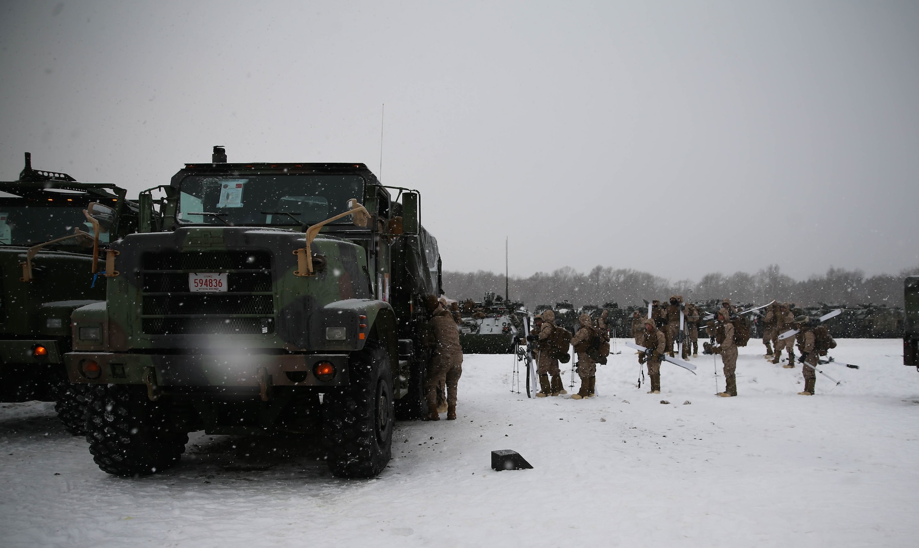 U.S. Marines from Golf Company, 2nd Battalion, 3rd Marine Regiment, 3rd Marine Division, get into 7-ton trucks to move to an area where they can conduct bilateral ski patrol training with Soldiers from 5th Brigade, Japan Ground Self-Defense Force (JGSDF), during exercise Northern Viper on Hokudaien Training Area, Hokkaido, Japan, Jan. 24, 2020. Northern Viper is a regularly scheduled training exercise that is designed to enhance the collective defense capabilities of the U.S. and Japan Alliance by exposing members of both forces to intense training in an austere environment, allowing them to perfect their skills in any clime and place. (U.S. Marine Corps Photo By Cpl. Cameron E. Parks)