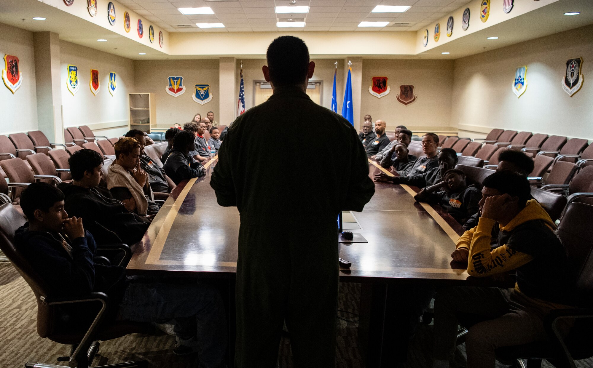 Capt. Marcus, 432nd Wing executive officer, teaches Iron Sharpens Iron Mentoring youth about the 432nd Wing’s mission during their visit to Creech Air Force Base, Nevada