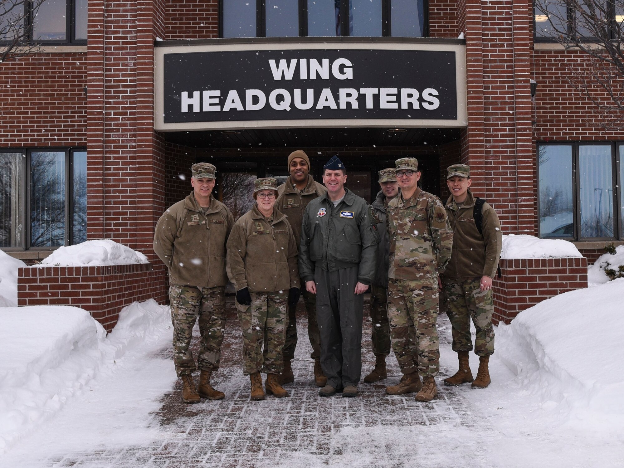 Chief Master Sergeant George Cum, far left, Chief of Medical Enlisted Force, Lt. Gen. Dorothy A. Hogg, second from left, Air Force Surgeon General, and their team, pose for a photo with 319th Reconnaissance Wing leadership at Grand Forks Air Force Base, N.D., Jan. 27, 2020. Hogg and her team were briefed on the 319th Reconnaissance Wing mission, and visited Grand Forks as part of their northern tier base tour. (U.S. Air Force photo by Senior Airman Melody Howley)