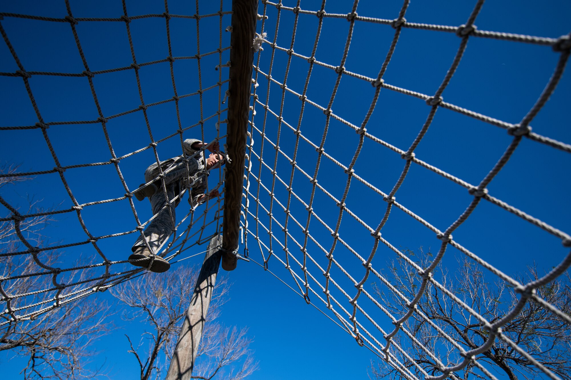 U.S. Air Force Airman 1st Class Jarred Mejia, 802nd Security Forces Squadron, Joint Base San Antonio-Lackland, takes part in the obstacle course portion of the Air Education and Training Command Defender Challenge team tryout at Joint Base San Antonio-Medina Annex, Texas, Jan. 29, 2020. The five-day selection camp includes a physical fitness test, M-9 and M-4 weapons firing, the alpha warrior obstacle course, a ruck march and also includes a military working dog tryout as well. A total of 27 Airmen, including five MWD handlers and their canine partners, were invited to tryout for the team. The seven selectees to the AETC team will represent the First Command at the career field’s world-wide competition that will be held at JBSA-Camp Bullis in May 2020. (U.S. Air Force photo by Sarayuth Pinthong)