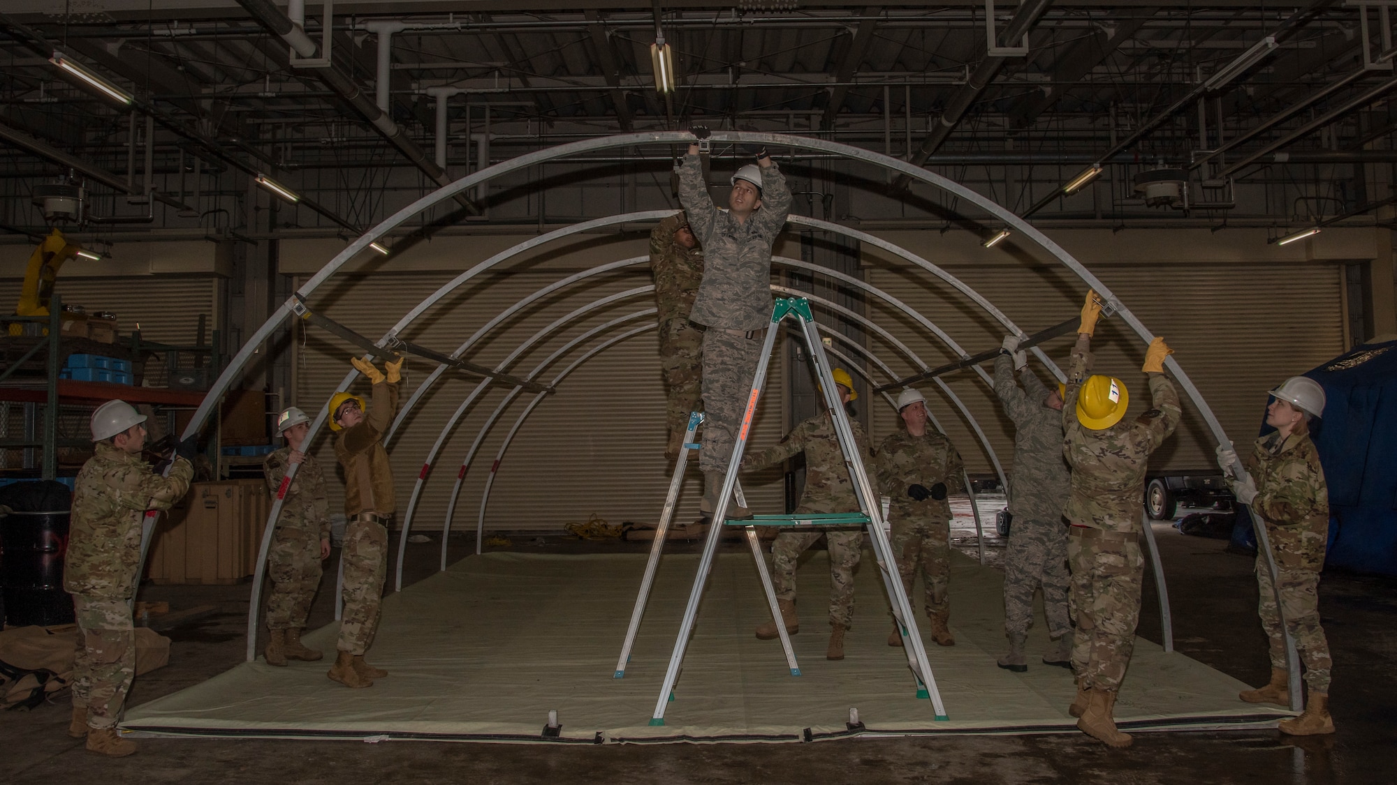 Airmen from the 35th Fighter Wing set up an Alaskan shelter system at Misawa Air Base, Japan, Jan. 29, 2020. More than 25 Airmen from the 35th Operations support squadron, 35th Logistics Readiness squadron, 35th Civil Engineer Squadron, 35th Force Support Squadron and 35th Aircraft Maintenance Squadron teamed up to enhance their readiness by participating in the first Multi-Domain Airman training. (U.S. Air Force photo by Airman 1st Class China M. Shock)