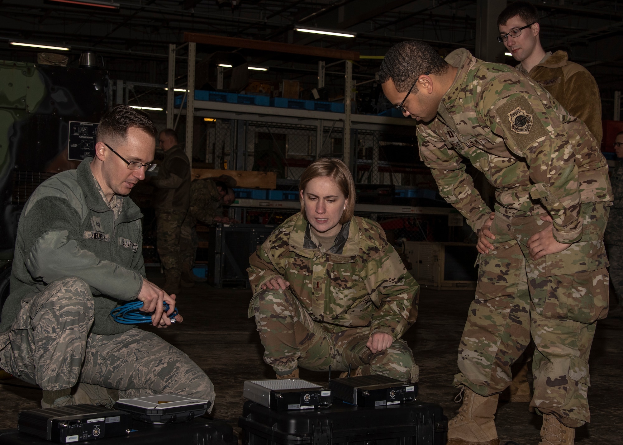 Airmen from the 35th Fighter Wing set up a communication flyaway kit at Misawa Air Base, Japan, Jan. 29, 2020. The CFK provides Non-secure Internet Protocol Router, Secure Internet Protocol Router and Voice Over Secure Internet Protocol capability within 30 minutes during emergency and contingency operations. The concept behind Multi-Domain Airman training is to to utilize Agile Combat Employment tactics, techniques and procedures in support of ACE operations. (U.S. Air Force photo by Airman 1st Class China M. Shock)