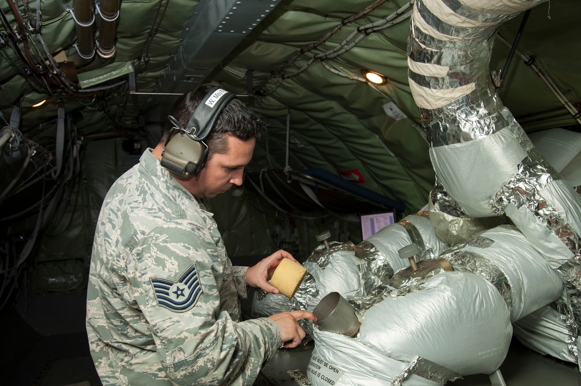 U.S. Air Force Tech. Sgt. Wesley May, a 6th Aircraft Maintenance Squadron aerospace propulsion specialist, inspects an auxiliary power unit on a KC-135 Stratotanker, Jan. 23, 2020, at MacDill Air Force Base, Fla. Aerospace propulsion Airmen are responsible for ensuring the proper operation of all aircraft engine components including fuel, oil, electrical and airflow systems.