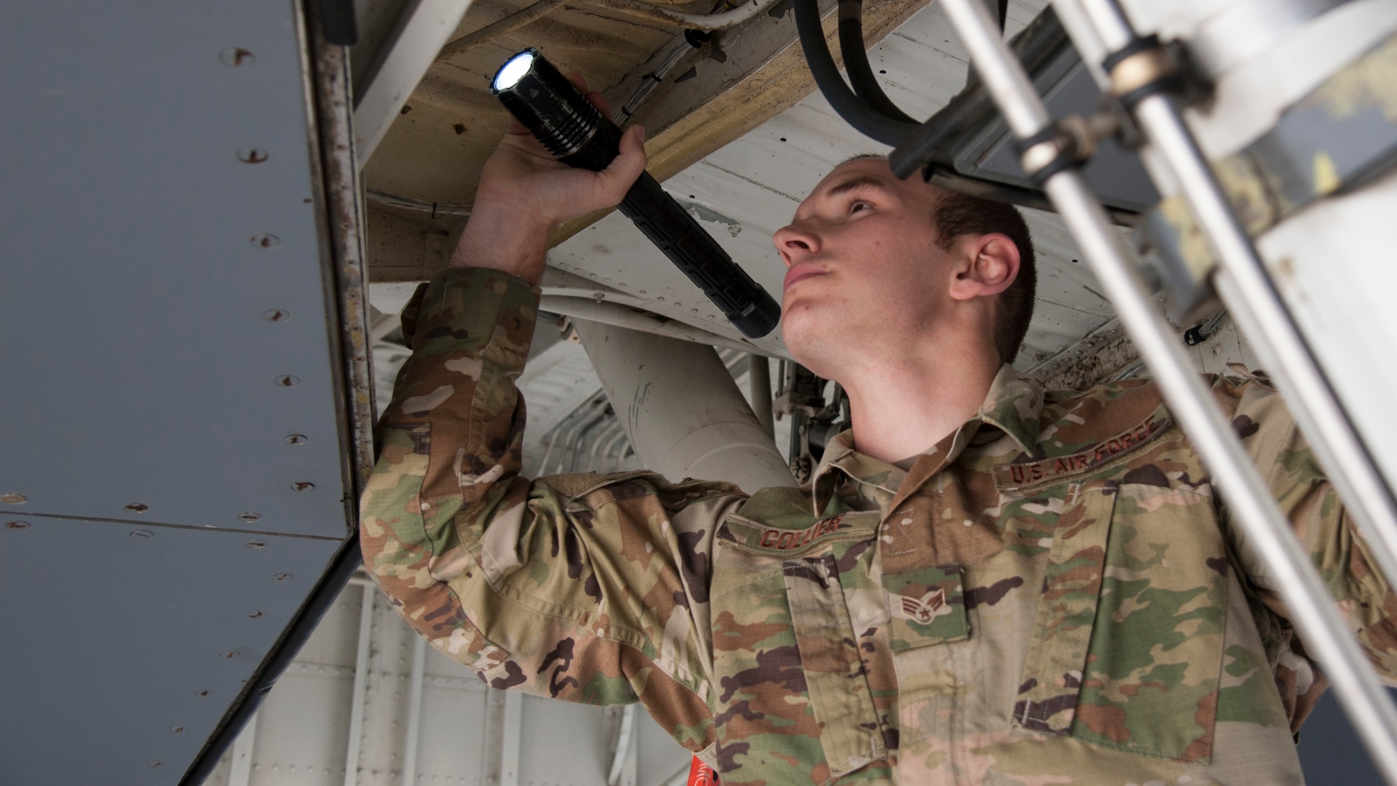 U.S. Air Force Senior Airman Clayton Collier, a 6th Aircraft Maintenance Squadron (AMXS) crew chief, inspects landing gear systems on a KC-135 Stratotanker, Jan. 23, 2020, at MacDill Crew chiefs assigned to the 6th AMXS perform aircraft maintenance and conduct inspections and servicing to ensure the KC-135 accomplishes its primary mission of global reach.