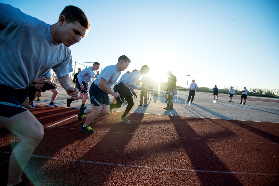 U.S. Air Force Security Forces Airmen take part in the run portion of a physical fitness test as the opening day of the Air Education and Training Command Defender Challenge team tryout at Joint Base San Antonio-Lackland, Texas, Jan. 27, 2020. The five-day selection camp includes a physical fitness test, M-9 and M-4 weapons firing, the alpha warrior obstacle course, a ruck march and also includes a military working dog tryout as well. A total of 27 Airmen, including five MWD handlers and their canine partners, were invited to tryout for the team. The seven selectees to the AETC team will represent the First Command at the career field’s world-wide competition that will be held at JBSA-Camp Bullis in May 2020. (U.S. Air Force photo by Sarayuth Pinthong)