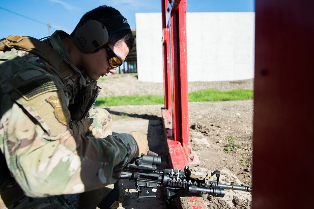 U.S. Air Force Security Forces Airmen take part in the firing range portion of the Air Education and Training Command Defender Challenge team tryout at Joint Base San Antonio-Medina Annex, Texas, Jan. 27, 2020. The five-day selection camp includes a physical fitness test, M-9 and M-4 weapons firing, the alpha warrior obstacle course, a ruck march and also includes a military working dog tryout as well. A total of 27 Airmen, including five MWD handlers and their canine partners, were invited to tryout for the team. The seven selectees to the AETC team will represent the First Command at the career field’s world-wide competition that will be held at JBSA-Camp Bullis in May 2020. (U.S. Air Force photo by Sarayuth Pinthong)