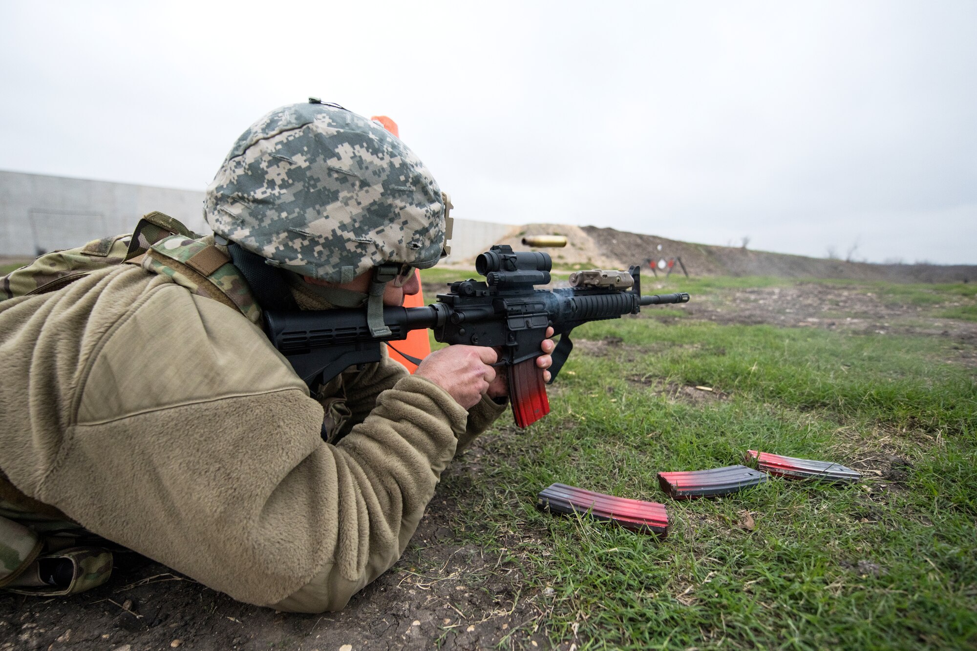 U.S. Air Force Senior Master Sgt. Jon Geren, 17th Security Forces Squadron, Goodfellow Air Force Base, Texas, takes part in the firing range portion of the Air Education and Training Command Defender Challenge team tryout at Joint Base San Antonio-Medina Annex, Texas, Jan. 30, 2020. The five-day selection camp includes a physical fitness test, M-9 and M-4 weapons firing, the alpha warrior obstacle course, a ruck march and also includes a military working dog tryout as well. A total of 27 Airmen, including five MWD handlers and their canine partners, were invited to tryout for the team. The seven selectees to the AETC team will represent the First Command at the career field’s world-wide competition that will be held at JBSA-Camp Bullis in May 2020. (U.S. Air Force photo by Sarayuth Pinthong)