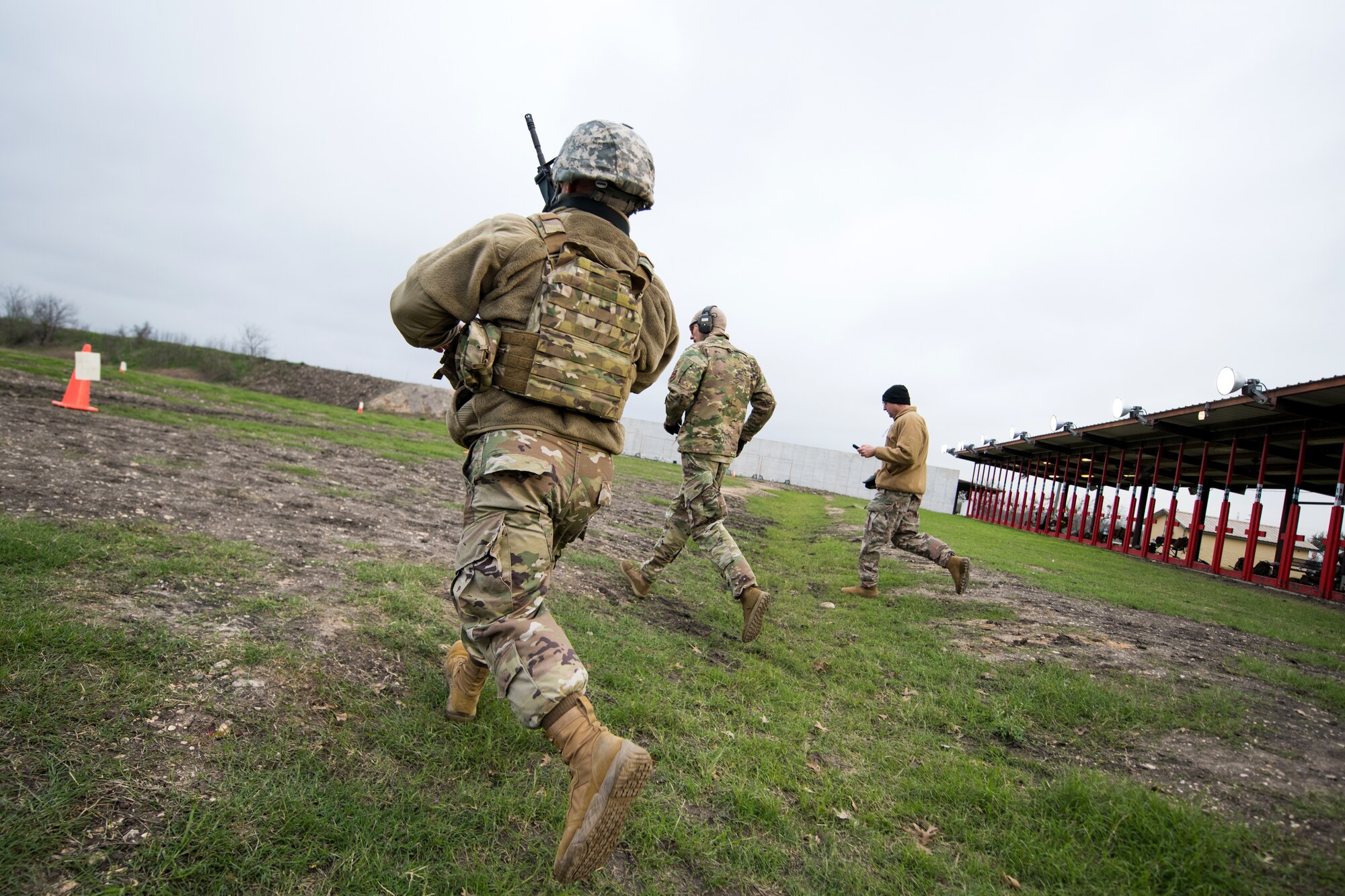 U.S. Air Force Senior Master Sgt. Jon Geren, 17th Security Forces Squadron, Goodfellow Air Force Base, Texas, takes part in the firing range portion of the Air Education and Training Command Defender Challenge team tryout at Joint Base San Antonio-Medina Annex, Texas, Jan. 30, 2020. The five-day selection camp includes a physical fitness test, M-9 and M-4 weapons firing, the alpha warrior obstacle course, a ruck march and also includes a military working dog tryout as well. A total of 27 Airmen, including five MWD handlers and their canine partners, were invited to tryout for the team. The seven selectees to the AETC team will represent the First Command at the career field’s world-wide competition that will be held at JBSA-Camp Bullis in May 2020. (U.S. Air Force photo by Sarayuth Pinthong)