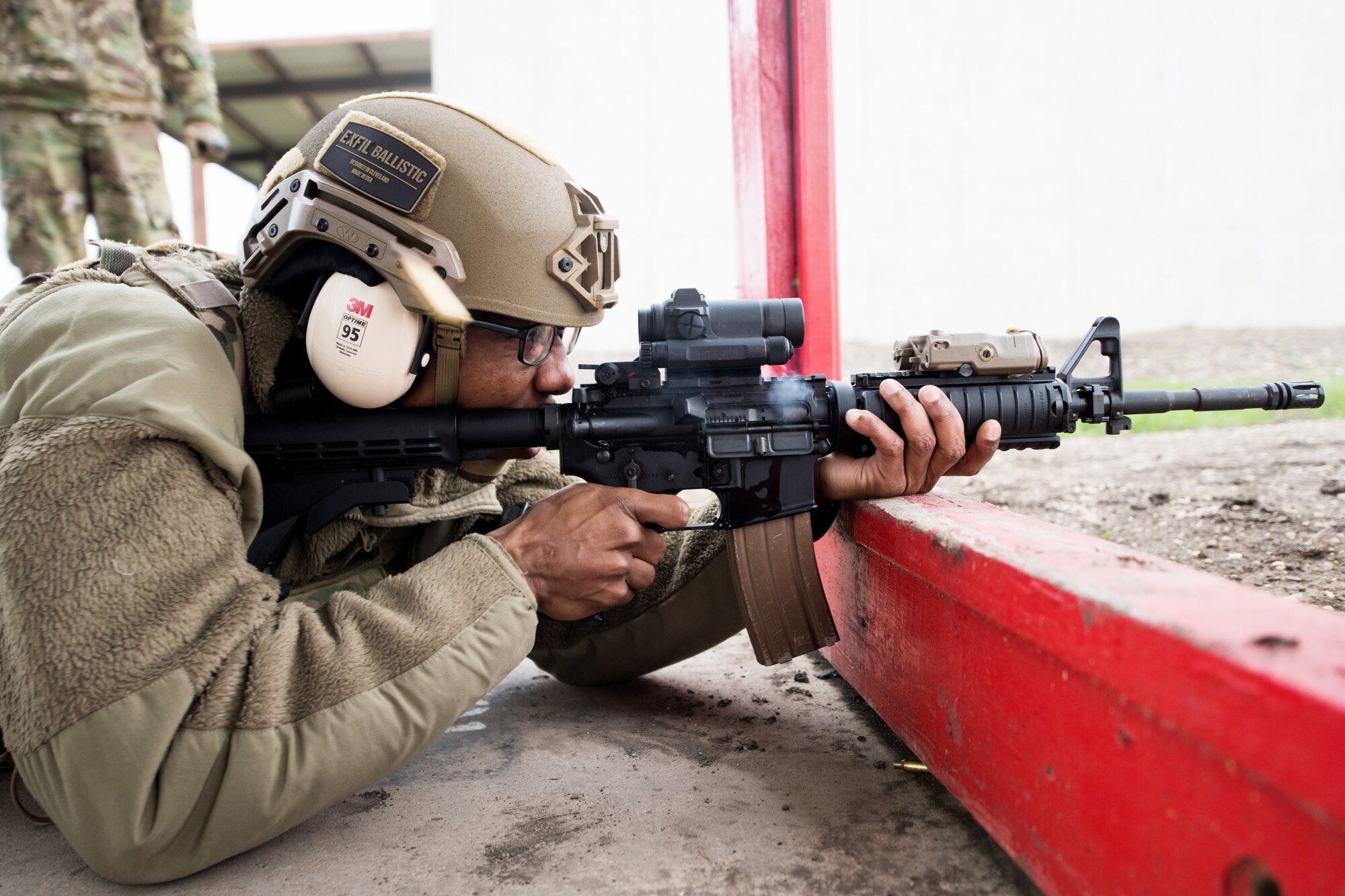 A U.S. Air Force Security Forces Airman takes part in the firing range portion of the Air Education and Training Command Defender Challenge team tryout at Joint Base San Antonio-Medina Annex, Texas, Jan. 30, 2020. The five-day selection camp includes a physical fitness test, M-9 and M-4 weapons firing, the alpha warrior obstacle course, a ruck march and also includes a military working dog tryout as well. A total of 27 Airmen, including five MWD handlers and their canine partners, were invited to tryout for the team. The seven selectees to the AETC team will represent the First Command at the career field’s world-wide competition that will be held at JBSA-Camp Bullis in May 2020. (U.S. Air Force photo by Sarayuth Pinthong)