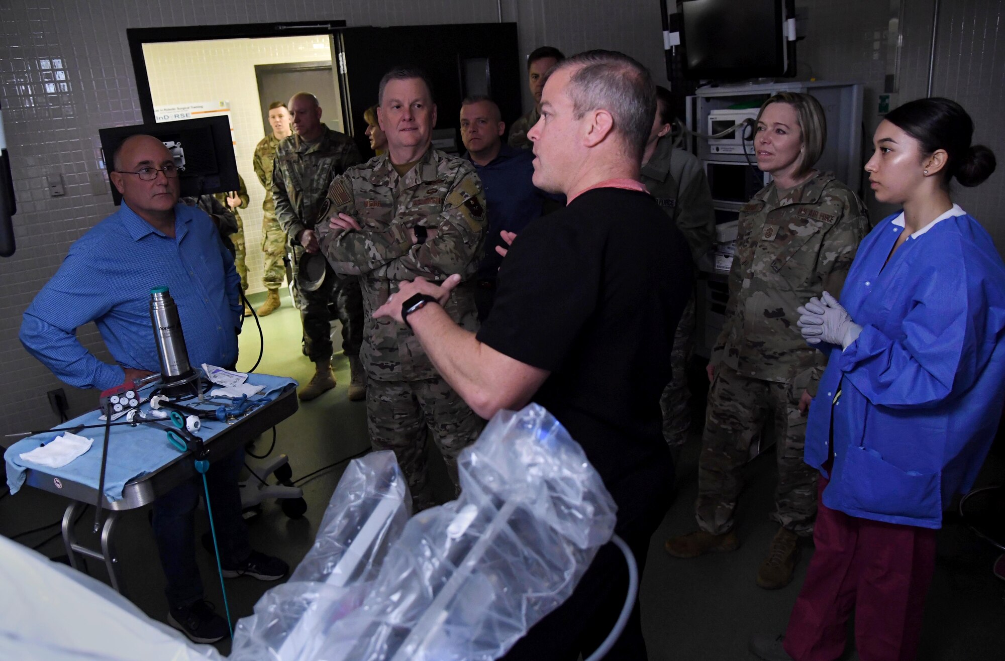 Greg Street, Intuitive Surgical instructor, briefs on the robotics surgery training course to Lt. Gen. Brad Webb, commander of Air Education and Training Command, and Chief Master Sgt. Julie Gudgel, command chief of AETC, during an immersion tour inside the Clinical Research Lab at Keesler Air Force Base, Mississippi, Jan. 31, 2020. The AETC command team visited Keesler in order to become more familiar with the mission capabilities of the 81st Training Wing and to view the paradigm shift occurring in the training environment within the 81st Training Group. (U.S. Air Force photo by Kemberly Groue)
