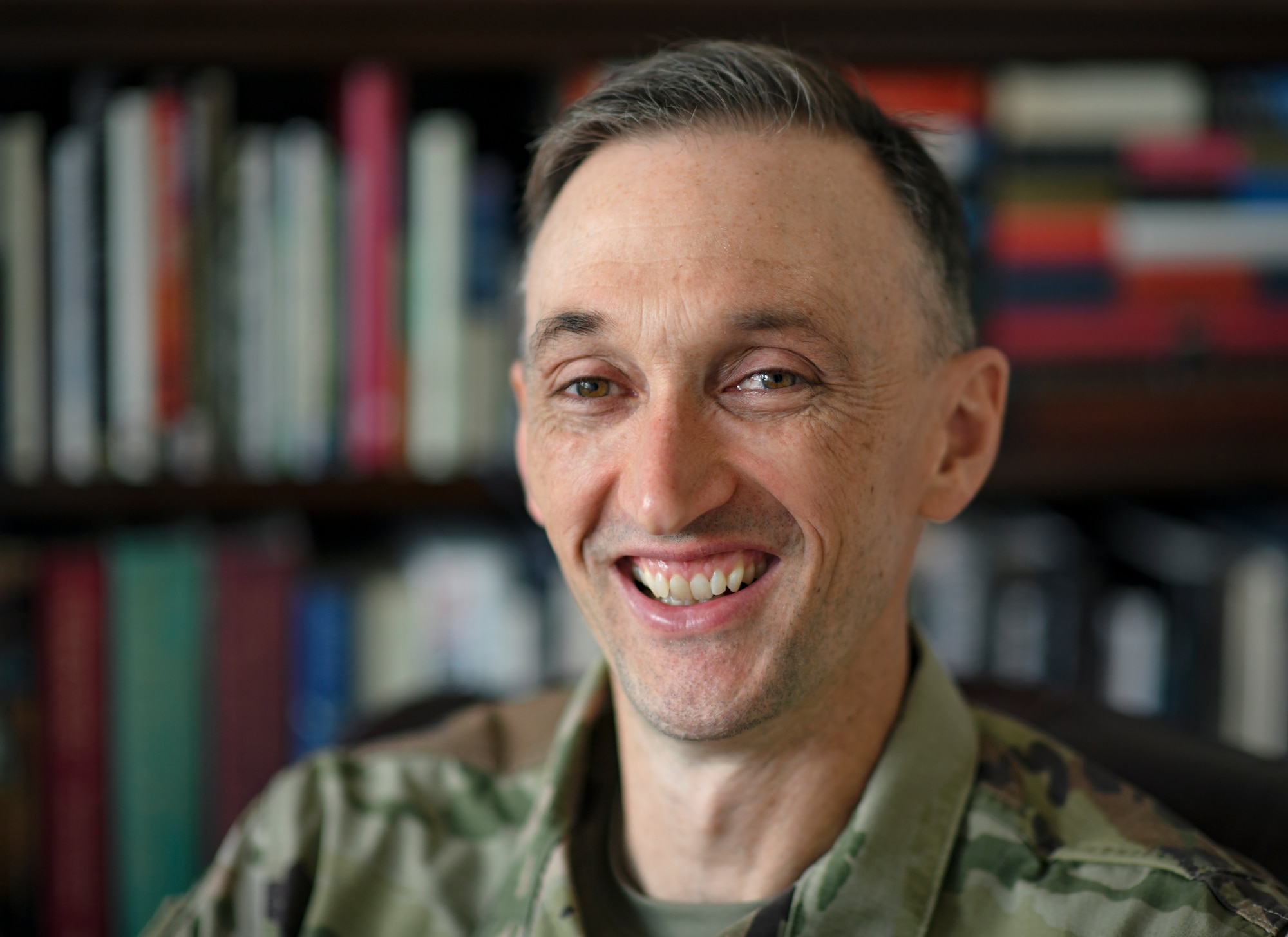 U.S. Air Force Chaplain (Maj.) Mark Hunsinger, 435th Air Expeditionary Wing and 435th Air Ground Operations Wing chaplain, smiles for a photo in his office at Ramstein Air Base, Germany, June 30, 2020. Hunsinger earned the 2019 Military Chaplains Association Distinguished Service Award, which is presented to one chaplain from each branch of service every year for exemplifying the highest standards of the military and the Chaplain Corps. (U.S. Air Force photo by Airman 1st Class Madeline Herzog)