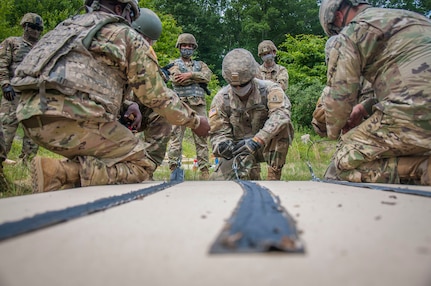 Connecticut National Guard Spc. Christian Diaz, an engineer assigned to the 250th Multi-Role Bridge Company, prepares a breach charge during a training event at Stones Ranch Military Reservation in Easy Lyme, Connecticut, June 15, 2020. This two-day event was part of the unit’s two-week annual training.