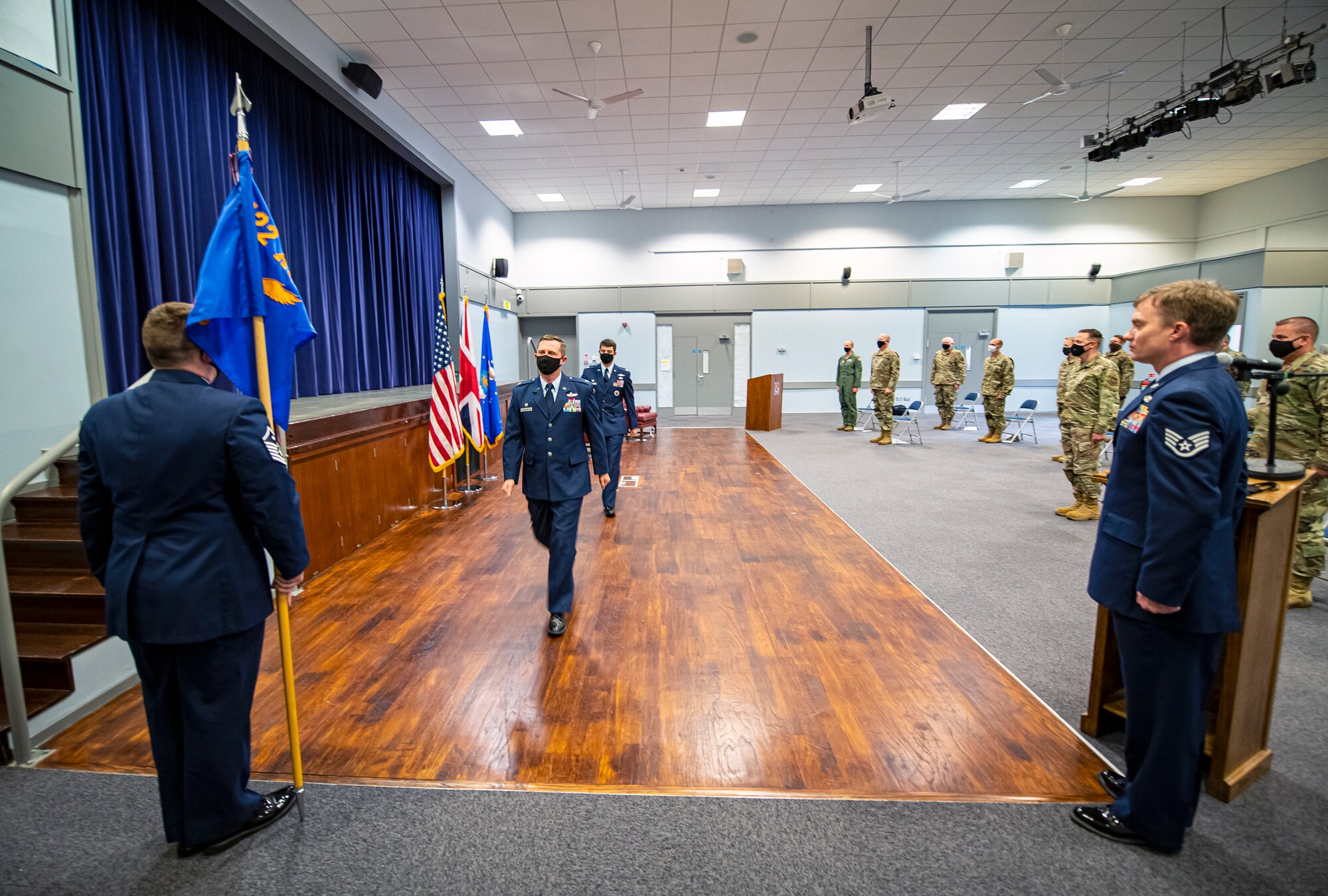 U.S. Air Force Col. Jon T. Hannah (center left), 422d Air Base Group commander, and U.S. Air Force Maj. Adam Cross (center right), 422d Communications Squadron incoming commander, exits as the official party during an assumption of command ceremony, at RAF Croughton, England, June 30, 2020. An assumption of command is a military tradition that represents a formal assumption of a unit’s authority and responsibility by a commander. (U.S. Air Force photo by Senior Airman Eugene Oliver)