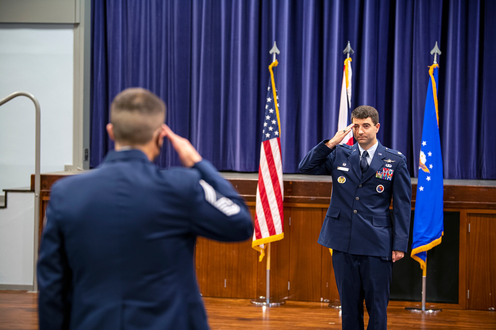 U.S. Air Force Maj. Adam Cross, salutes Airmen from the 422d Communications Squadron, after assuming command of the squadron, at RAF Croughton, June 30, 2020. Cross has previously served on the Headquarters Air Force staff supporting the Office of Information Dominance and Chief Information Officer, Pentagon, Washington D.C. He has deployed in support of multiple contingency operations in Southwest Asia and the Horn of Africa. (U.S. Air Force photo by Senior Airman Eugene Oliver)