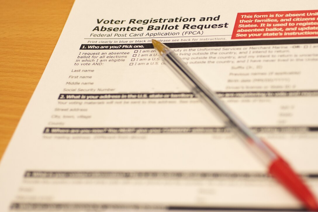 Federal Post Card Applications can be picked up from the Voting Assistance Office at RAF Mildenhall. Airmen can register to vote and request absentee ballots overseas to ensure their voice is heard in elections at home. (U.S. Air Force photo by Airman 1st Class Joseph Barron)