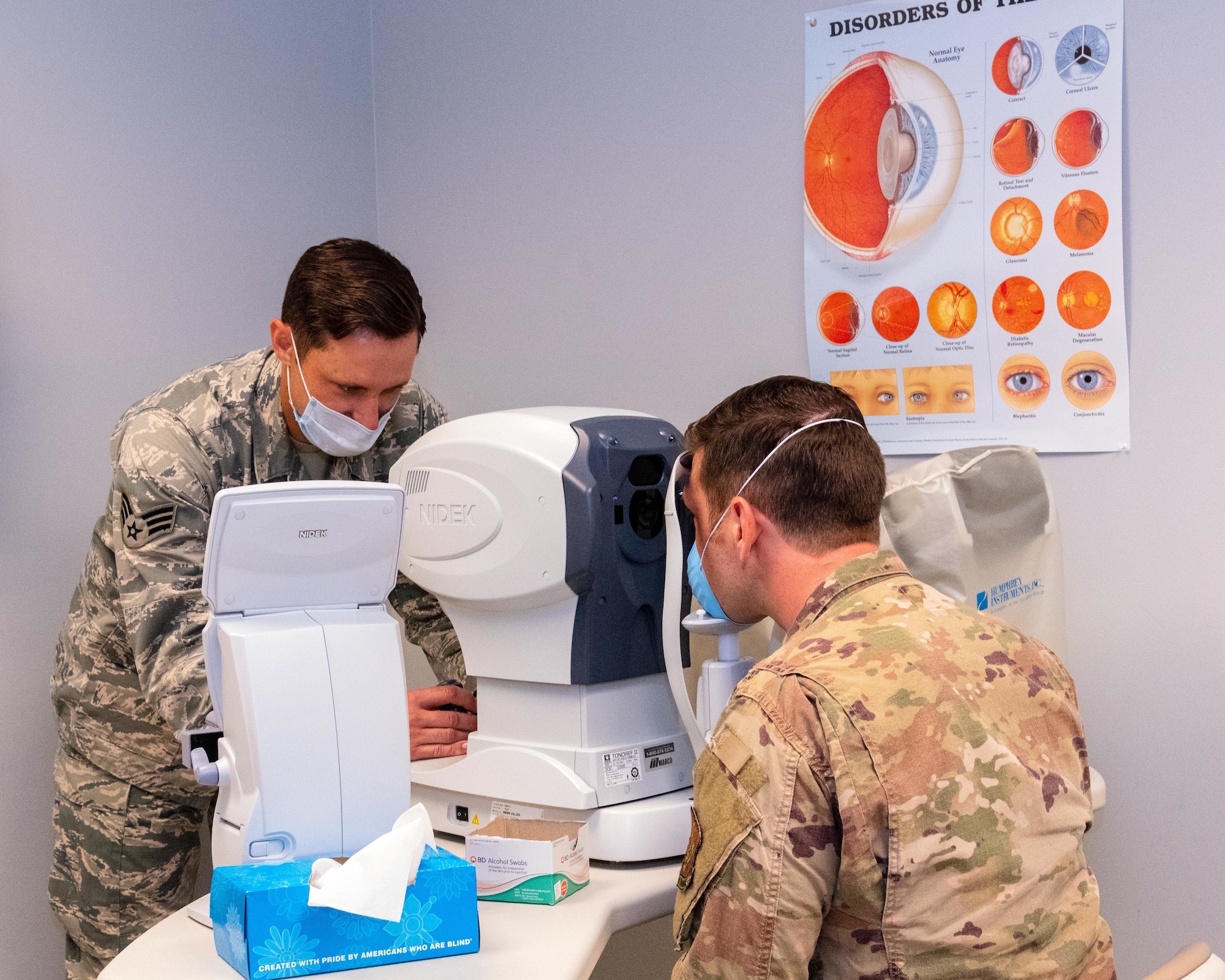 Air Force Reserve Senior Airman Lewis Alexander, 913th Aerospace Medicine Squadron optometry technician demonstrates an eye exam at Little Rock Air Force Base, Ark., June, 6, 2020. While adhering to COVID-19 health protection procedures, Alexander takes photos of the patient’s eye to assess vision and identify eye disorders, ensuring deployment readiness for Airmen and the group. Individual medical readiness includes a number of regular medical examinations required for deployment readiness. (U.S. Air Force Reserve photo by Maj. Ashley Walker)