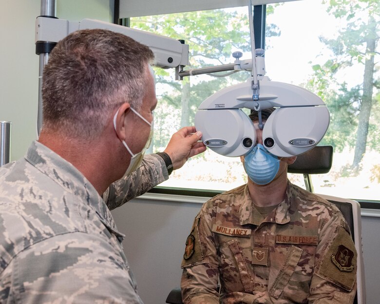 Air Force Reserve Lt. Col. Wayne Jones, 913th Aerospace Medicine Squadron optometrist, demonstrates eye examinations June 6, 2020, at Little Rock Air Force Base, Ark. Optometrists perform yearly eye exams to assess vision and identify eye disorders, ensuring deployment readiness for Airmen and the group. Individual medical readiness includes a number of regular medical examinations required for deployment readiness. (U.S. Air Force Reserve photo by Maj. Ashley Walker)