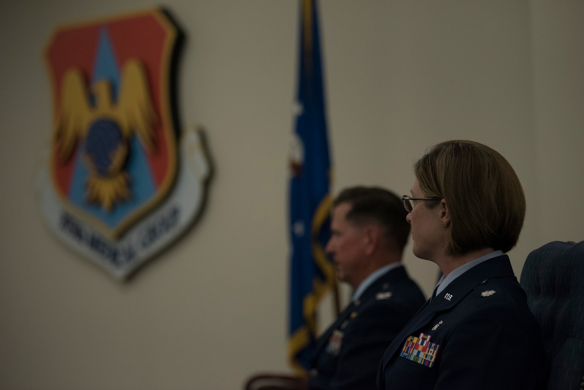 U.S. Air Force members listen to speaker