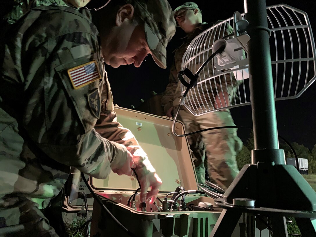 Pulling an all-nighter - Members of the Army Cyber Institute demonstrate the capabilities of their High Frequency technology and equipment to Mr. Adam Nucci, HQDA Cyber, during Cyber Blitz.