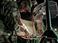 Pulling an all-nighter - Members of the Army Cyber Institute demonstrate the capabilities of their High Frequency technology and equipment to Mr. Adam Nucci, HQDA Cyber, during Cyber Blitz.