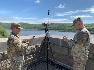 Capt. Victor Mitsuoka and Lt. Col. Brett Lindberg use a combination of RTK GPS receivers and geodetic benchmarks to more accurately provide locations of targets within centimeters on augmented reality overlays.