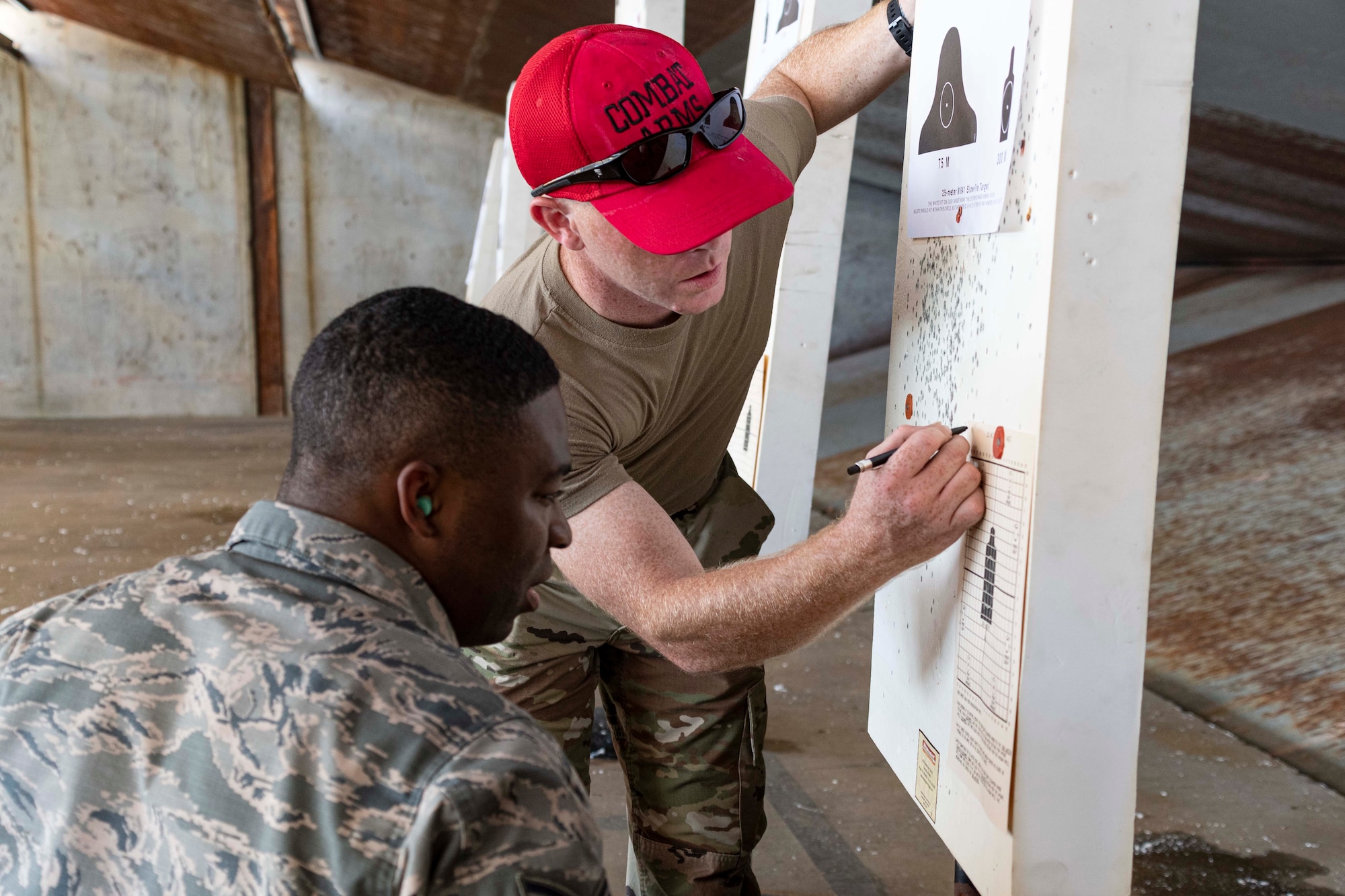 Photo of Airman looking at firing target.