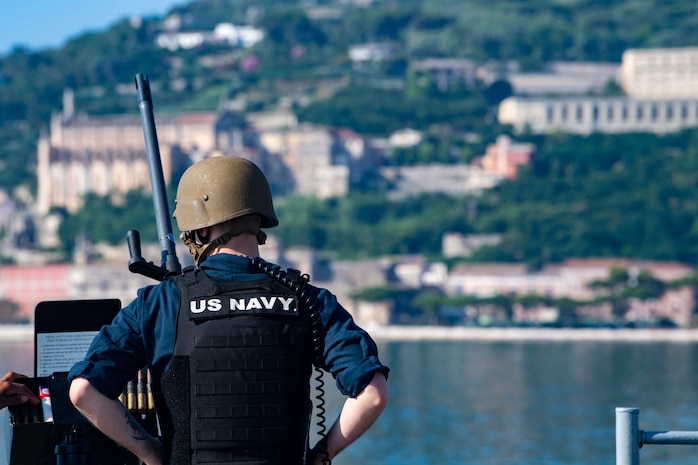 200701-N-BM428-0010 GAETA, Italy (July 1, 2020) Retail Services Specialist Seaman Teddy Kendrick, assigned to the Blue Ridge-class command and control ship USS Mount Whitney (LCC 20), stands watch while the ship returns to homeport in Gaeta, Italy, July 1, 2020. Mount Whitney is the U.S. 6th Fleet flagship, homeported in Gaeta, and operates with a combined crew of U.S. Sailors and Military Sealift Command civil service mariners. (U.S. Navy photo by Mass Communication Specialist 2nd Class Damon Grosvenor)