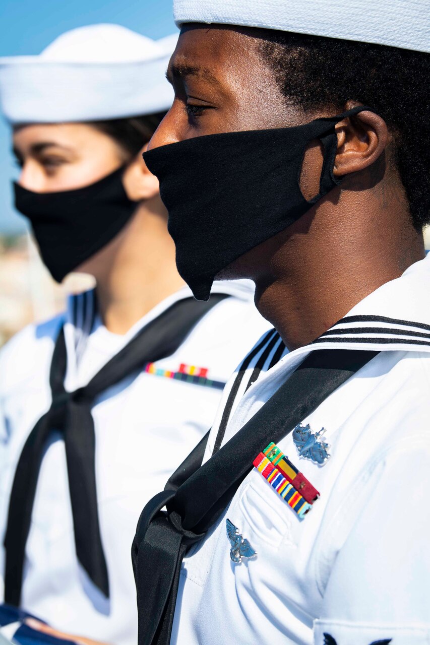 200701-N-BM428-0031 GAETA, Italy (July 1, 2020) Yeoman 2nd Class Jerrell Pouncy, front, and Cryptologic Technician (Technical) Seaman Elizabeth Hall, back, both assigned to the Blue Ridge-class command and control ship USS Mount Whitney (LCC 20), stand at attention before colors as the ship returns to homeport in Gaeta, Italy, July 1, 2020. Mount Whitney is the U.S. 6th Fleet flagship, homeported in Gaeta, and operates with a combined crew of U.S. Sailors and Military Sealift Command civil service mariners. (U.S. Navy photo by Mass Communication Specialist 2nd Class Damon Grosvenor)