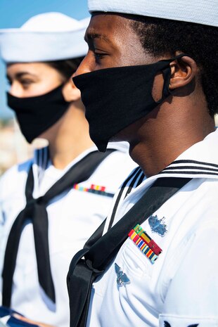 200701-N-BM428-0031 GAETA, Italy (July 1, 2020) Yeoman 2nd Class Jerrell Pouncy, front, and Cryptologic Technician (Technical) Seaman Elizabeth Hall, back, both assigned to the Blue Ridge-class command and control ship USS Mount Whitney (LCC 20), stand at attention before colors as the ship returns to homeport in Gaeta, Italy, July 1, 2020. Mount Whitney is the U.S. 6th Fleet flagship, homeported in Gaeta, and operates with a combined crew of U.S. Sailors and Military Sealift Command civil service mariners. (U.S. Navy photo by Mass Communication Specialist 2nd Class Damon Grosvenor)