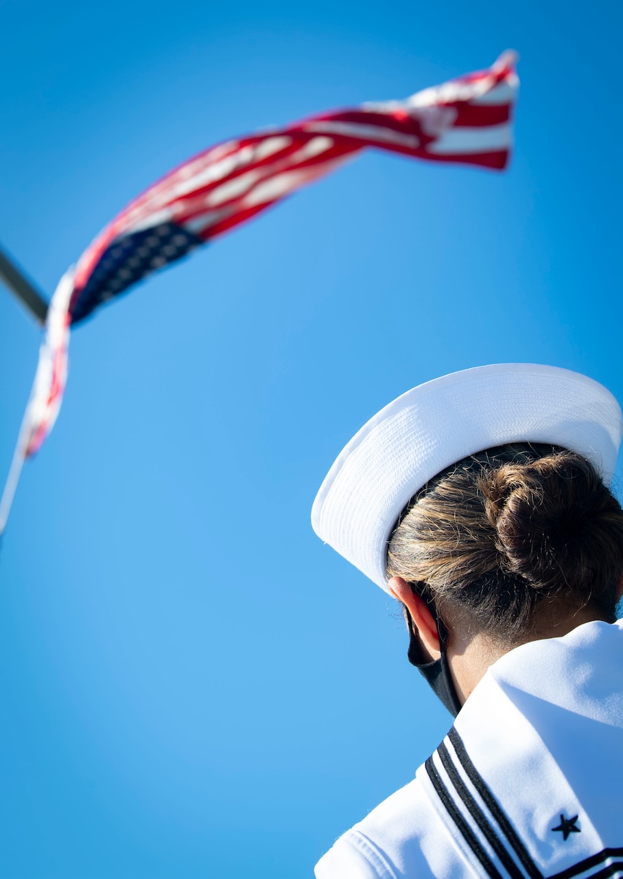 200701-N-BM428-0034 GAETA, Italy (July 1, 2020) Cryptologic Technician (Technical) Seaman Elizabeth Hall, assigned to the Blue Ridge-class command and control ship USS Mount Whitney (LCC 20), salutes the American Flag as it is raised during colors aboard the ship as the ship returns to homeport in Gaeta, Italy, July 1, 2020. Mount Whitney is the U.S. 6th Fleet flagship, homeported in Gaeta, and operates with a combined crew of U.S. Sailors and Military Sealift Command civil service mariners. (U.S. Navy photo by Mass Communication Specialist 2nd Class Damon Grosvenor)