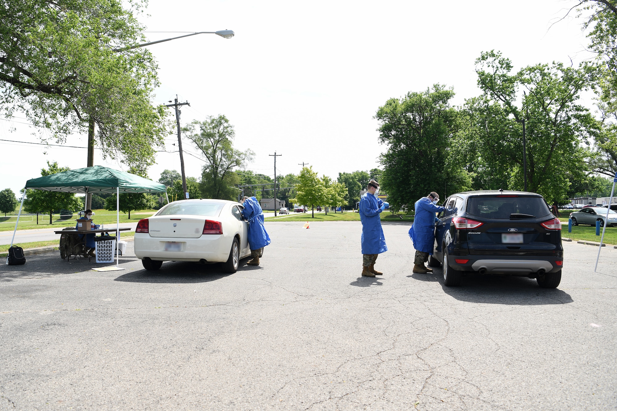 Local community members receive COVID-19 testing June 17, 2020 at Community Building Institute in Middletown, Ohio. Airmen from the 178th Wing and Soldiers assigned to the Ohio National Guard augmented staff members of Centerpoint Health to help with drive-thru Coronavirus testing of local community members. (U.S. Air National Guard photo by Staff Sgt. Amber Mullen)