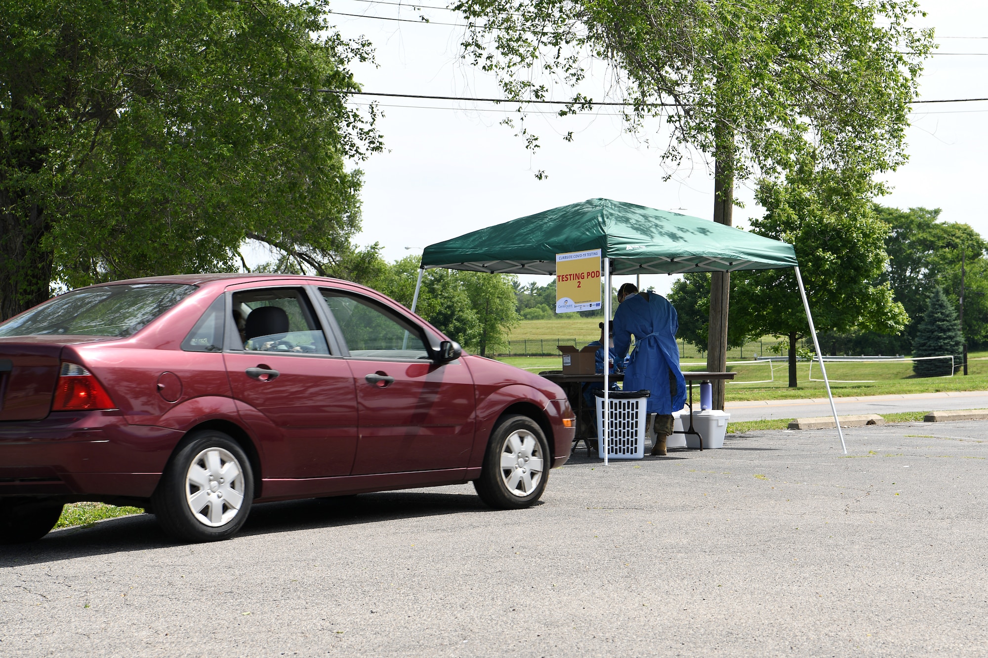 A local community member pulls up to a testing pod at the drive-thru COVID-19 testing site June 17, 2020 at Community Building Institute in Middletown, Ohio. Airmen from the 178th Wing and Soldiers assigned to the Ohio National Guard augmented staff members of Centerpoint Health to help with drive-thru Coronavirus testing of local community members. (U.S. Air National Guard photo by Staff Sgt. Amber Mullen)