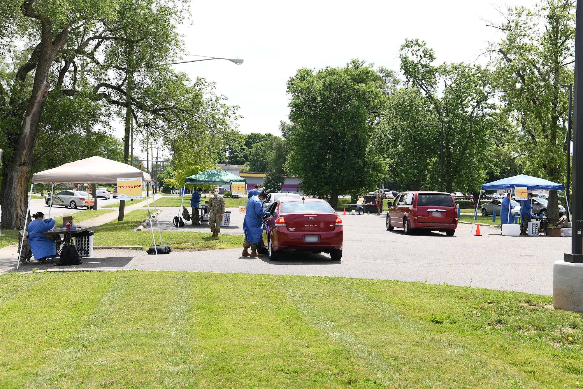 Local community members receive COVID-19 testing June 17, 2020 at Community Building Institute in Middletown, Ohio. Airmen from the 178th Wing and Soldiers assigned to the Ohio National Guard augmented staff members of Centerpoint Health to help with drive-thru Coronavirus testing of local community members. (U.S. Air National Guard photo by Staff Sgt. Amber Mullen)