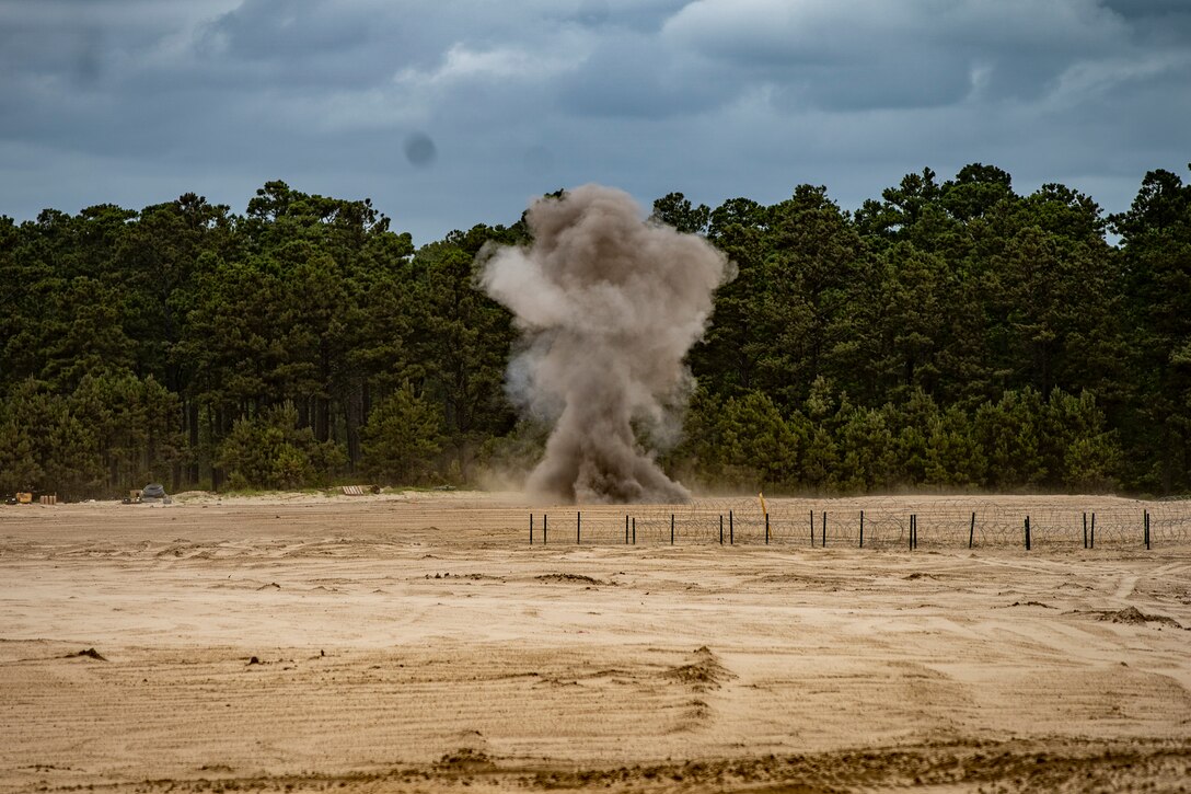 Marines with Special Purpose Marine Air-Ground Task Force - Southern Command conduct demolition training during a field exercise at Camp Lejeune, North Carolina, June 9, 2020. The FEX provides the Marines and Sailors the opportunity to stay proficient with their equipment and refine their tactical skill sets. SPMAGTF-SC is poised to conduct crisis response, general engineering training and theater security cooperations alongside partner nation militaries in Latin America and the Caribbean.  (U.S. Marine Corps photo by Sgt. Andy O. Martinez)