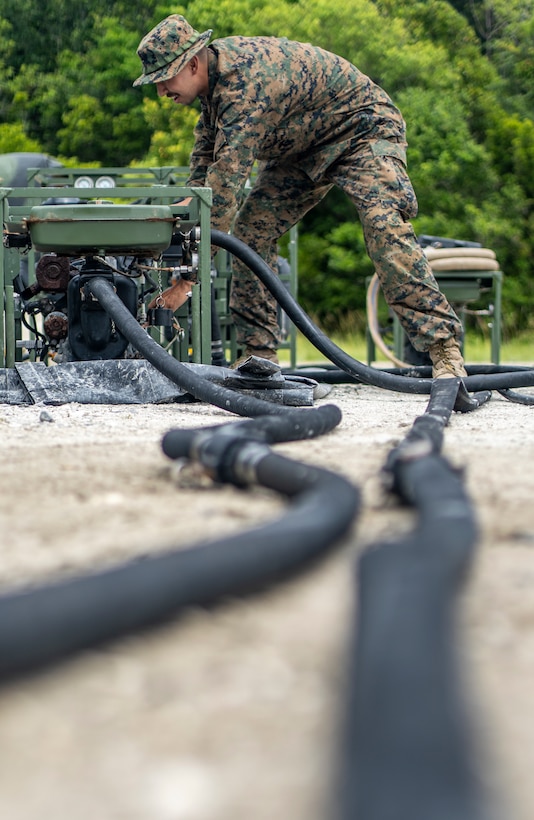 Lance Cpl. Anthony Bryan, a water support technician with Special Purpose Marine Air-Ground Task Force - Southern Command, sets up a lightweight water purification system during a field exercise at Camp Lejeune, North Carolina, June 10, 2020. Water support technician Marines use lightweight water purification systems to purify water in case of crisis response scenarios. The FEX provides the Marines and Sailors the opportunity to stay proficient with their equipment and refine their tactical skill sets. SPMAGTF-SC is poised to conduct crisis response, general engineering training and theater security cooperations alongside partner nation militaries in Latin America and the Caribbean.  Bryan is a native of Eugene, Oregon. (U.S. Marine Corps photo by Sgt. Andy O. Martinez)
