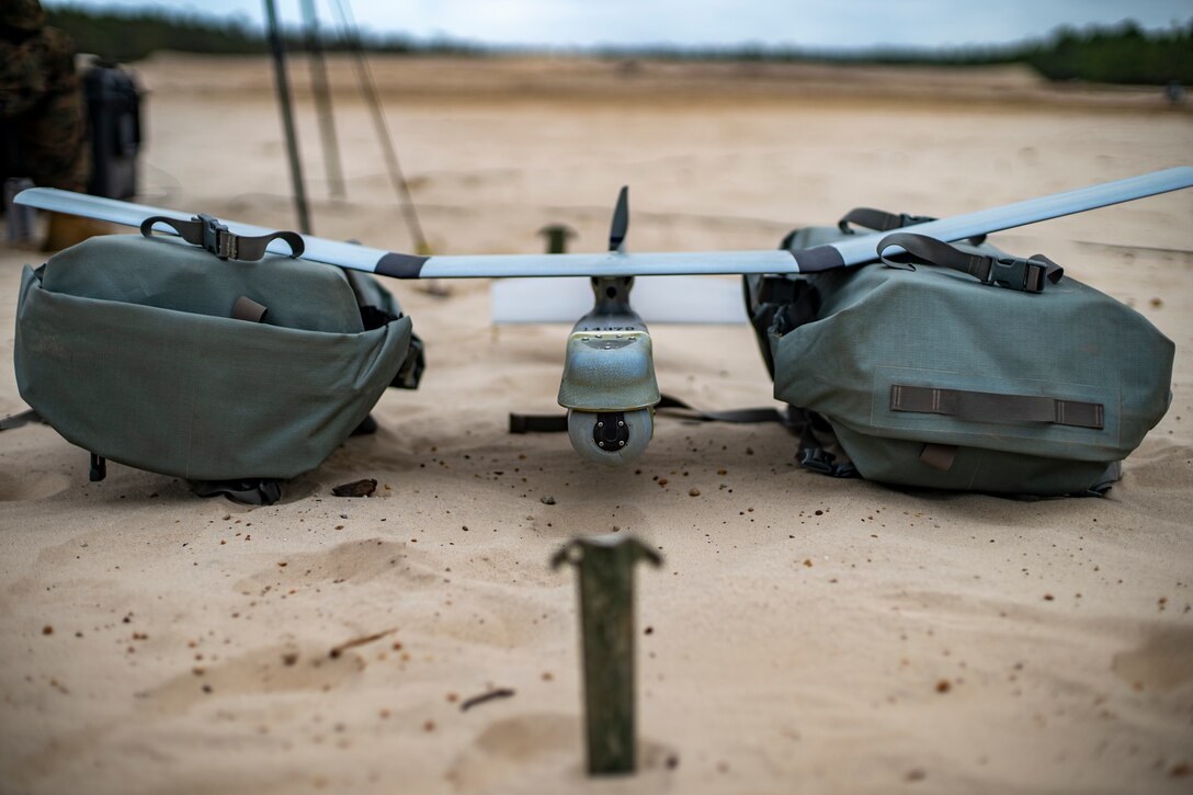 Marines with Special Purpose Marine Air-Ground Task Force - Southern Command operate an RQ-11B Raven during a field exercise at Camp Lejeune, North Carolina, June 11, 2020. The FEX provides the Marines and Sailors the opportunity to stay proficient with their equipment and refine their tactical skill sets. SPMAGTF-SC is poised to conduct crisis response, general engineering training and theater security cooperations alongside partner nation militaries in Latin America and the Caribbean. (U.S. Marine Corps photo by Sgt. Andy O. Martinez)