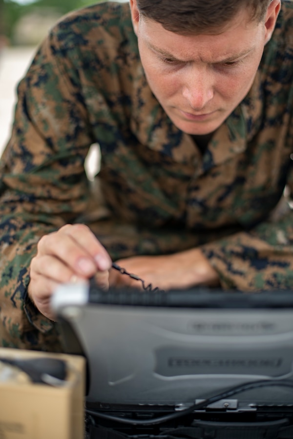 Cpl. Nicholas Whisenhunt, an engineer equipment operator with Special Purpose Marine Air-Ground Task Force - Southern Command, navigates a flight course for an RQ-11B Raven during a field exercise at Camp Lejeune, North Carolina, June 11, 2020. The FEX provides the Marines and Sailors the opportunity to stay proficient with their equipment and refine their tactical skill sets. SPMAGTF-SC is poised to conduct crisis response, general engineering training and theater security cooperations alongside partner nation militaries in Latin America and the Caribbean. Whisenhunt is a native of Keizer, Oregon. (U.S. Marine Corps photo by Sgt. Andy O. Martinez)