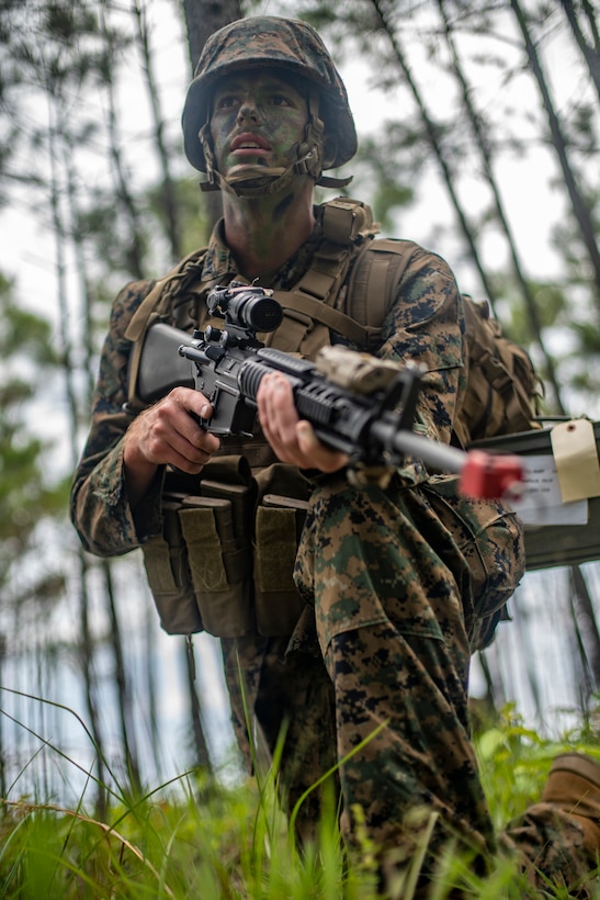 Lance Cpl. Vance Miller, a combat engineer with Special Purpose Marine Air-Ground Task Force - Southern Command, provides security while conducting a simulated patrol during a field exercise at Camp Lejeune, North Carolina, June 9, 2020. The FEX provides the Marines and Sailors the opportunity to stay proficient with their equipment and refine their tactical skill sets. SPMAGTF-SC is poised to conduct crisis response, general engineering training and theater security cooperations alongside partner nation militaries in Latin America and the Caribbean. Miller is a native of Salem, Oregon. (U.S. Marine Corps photo by Sgt. Andy O. Martinez)