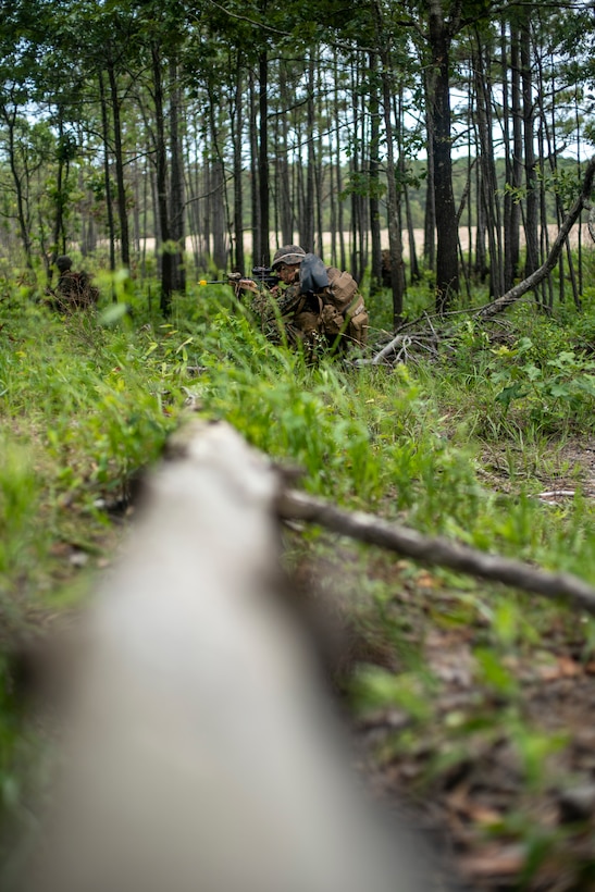 Marines with Special Purpose Marine Air-Ground Task Force - Southern Command provide security while conducting a simulated patrol during a field exercise at Camp Lejeune, North Carolina, June 8, 2020. The FEX provides the Marines and Sailors the opportunity to stay proficient with their equipment and refine their tactical skill sets. SPMAGTF-SC is poised to conduct crisis response, general engineering training and theater security cooperations alongside partner nation militaries in Latin America and the Caribbean. (U.S. Marine Corps photo by Sgt. Andy O. Martinez)