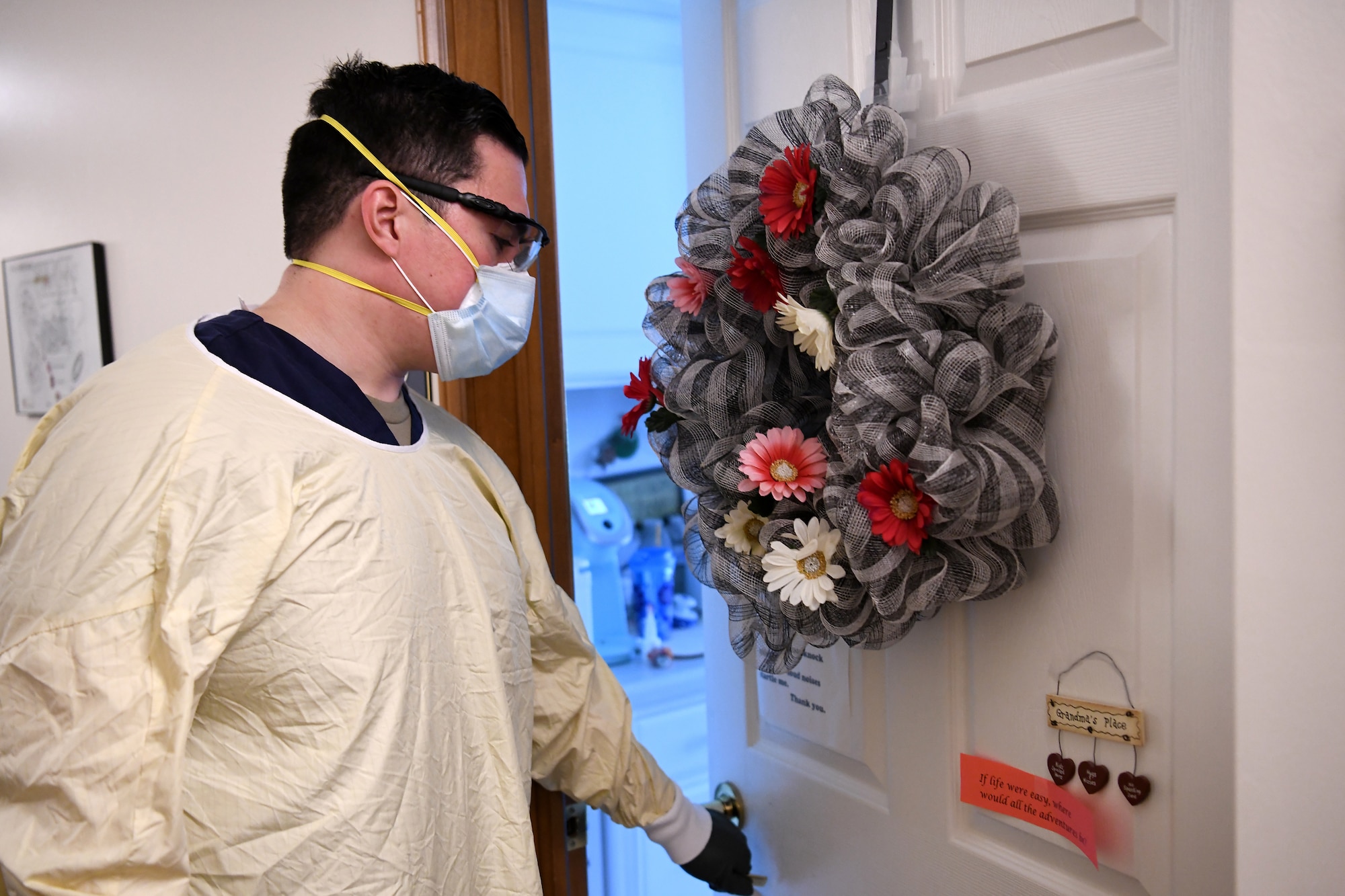 Staff Sgt. Mark Young, a financial management specialist assigned to the 121st Air Refueling Wing, enters the room of a resident of the Carlin House, May 27, 2020, in Logan, Ohio. Young was part of a 20-person team of Ohio National Guard members who were tasked with helping at the assisted living facility after over half of their staff and residents tested positive for COVID-19. (U.S. Air National Guard photo by Staff Sgt. Amber Mullen)