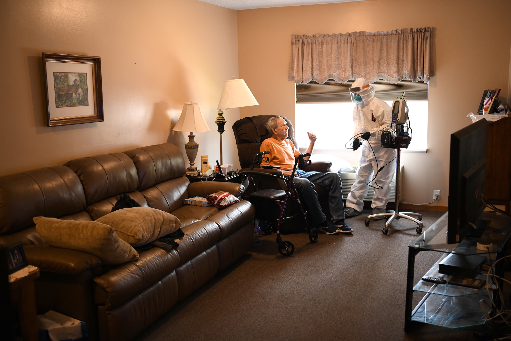Staff Sgt. Kathryn Dobbs, an aerospace medical technician assigned to the 180th Fighter Wing, talks with an asymptomatic COVID-19 positive resident May 27, 2020, at the Carlin House in Logan, Ohio. Dobbs was part of a 20-person team of Ohio National Guard members who were tasked with helping at the assisted living facility after over half of their staff and residents tested positive for COVID-19. (U.S. Air National Guard photo by Staff Sgt. Amber Mullen)